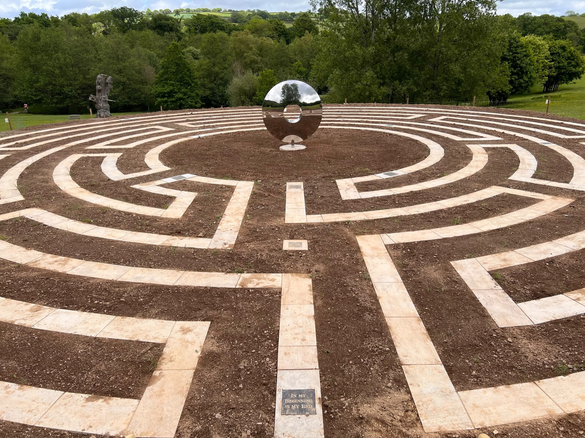 Large stone-paved labyrinth path laid into a Devon hillside by PC Landscaping